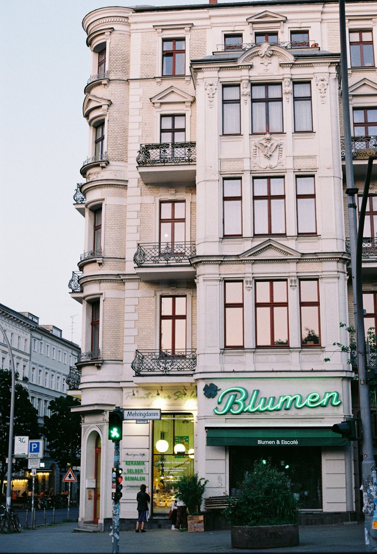 A beautiful, ornate building with a flower shop.